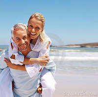 wife mature pic mature man piggybacking his wife beach royalty free stock photography