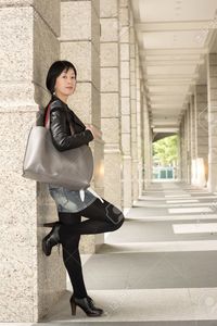 asian mature elwynn asian mature woman street length portrait stock photo