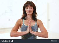 beautiful mature stock photo portrait beautiful mature woman sitting anjali mudra yoga pose gym meditating pic