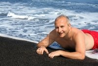 big mature barsik mature man black sand beach island hawaii photo