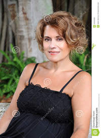 black mature beautiful mature woman black dress sitting bench royalty free stock