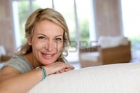 blond mature goodluz beautiful blond mature woman relaxing sofa photo