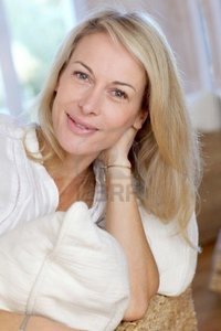 blond mature goodluz portrait blond mature woman relaxing sofa photo