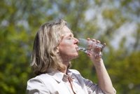 blond mature fotoarts beautiful mature blond woman drinking glass water summer heat photo