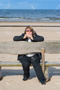 chubby mature fotorobs mature chubby woman relaxing baltic sea autumn day stock photo