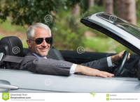 classy mature smiling mature businessman driving classy cabriolet sunny day royalty free stock photography