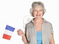 france mature logos portrait happy mature woman holding flag france against white photo