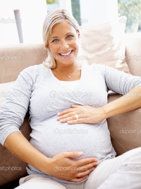 lady mature depositphotos mature pregnant lady holding belly smiling stock photo