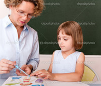 mature teacher depositphotos little girl working under supervision mature teacher stock photo