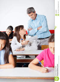 mature teacher angry teacher looking student mature standing arms crossed examination classroom stock photo