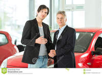 mature and young mature young man autos car dealership royalty free stock photo