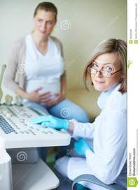 mature and young regular examination mature obstetrician looking camera background young women undergoing hospital royalty free stock photos