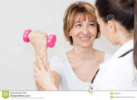 mature and young physical therapy charming mature patient lifts dumbbells young therapist stock photos