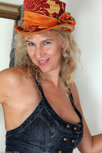 mature gilf photo large sabrina mature orange hat skirt strip free gilf pics