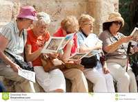 mature group group mature female tourists sitting outside church holy sepulchre holding brochures stock photography