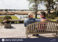 mature huge comp mature couple huge wooden deck luxury showcase house usa stock photo