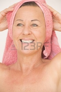 mature naked roboriginal portrait attractive mature woman naked towel head happy relaxed friendly smiling isolate photo