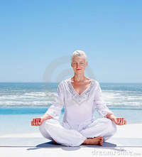 mature old relaxed mature old woman meditating beach royalty free stock photos