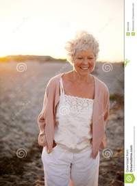 mature old happy mature woman walking beach portrait beautiful old caucasian lady smile face outdoors royalty free stock photos