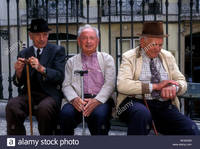 mature old comp ggm portuguese people person old mature elderly men sitting bench near stock photo