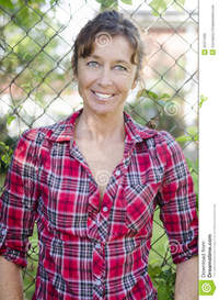 mature red happy smiling mature woman red checked shirt stock photo