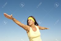 mature spread roboriginal portrait attractive fit healthy mature woman relaxed exercising outdoor arms spread out bal stock photo