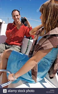 matures comp outdoor day summer water lake boat yacht sailboat sailing woman man stock photo