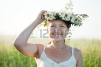 outdoor mature jackf outdoor portrait happy mature woman camomile chaplet photo