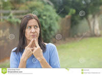outdoor mature worried woman thoughtful outdoor portrait attractive mature facial expression troubled look finger chin copy space royalty free stock photos