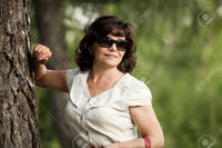 outdoor mature tankist close portrait mature beautiful woman black sun glasses outdoor park summer day stock photo