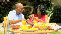 outdoor mature shutterstock videos video clip stock footage mature african american couple eating sensible healthy fresh food outdoors retirement home garden