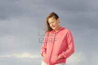 outdoor mature roboriginal lonely sad looking mature woman outdoor isolated dark storm clouds background copy photo