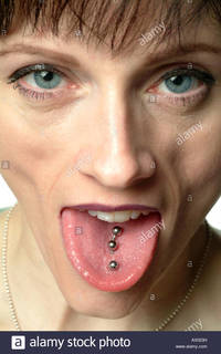 pierced mature comp close female face tongue pierced times stock photo stud