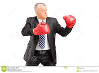 red mature mature businessman red boxing gloves ready fight stock photo