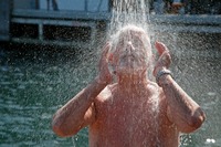 shower mature preview mature man taking cold shower after swim harbor bath