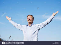 spreading mature comp cmtb mature man spreading his arms joy stock photo