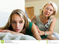 teen and mature mother comforting crying daughter mature sad teenage home stock photo