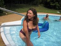 mature older woman porn mature woman thigh tattoo wearing purple bikini standing pool