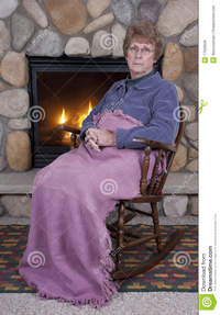 mature face pics mature senior woman sad face rocking chair fire royalty free stock photos
