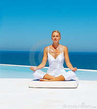 mature photos mature woman meditating sea shore royalty free stock photo