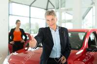 red mature kzenon mature single man red auto light car dealership female customer young woman stock photo