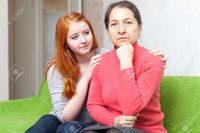 teen and mature jackf teen girl asks forgiveness from mother focus mature woman stock photo