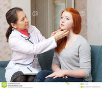 teen and mature mature female doctor touching neck teen patient clinic stock photos