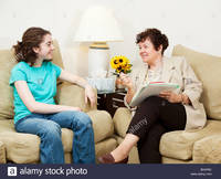 teen and mature comp teen girl being interviewed mature woman could college stock photo