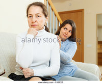 teen and mature zooms teen girl tries reconcile mother home focus mature fxt stock photo argument