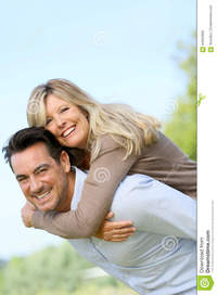 wife mature cheerful man carrying his wife back mature men giving piggyback ride woman stock photo
